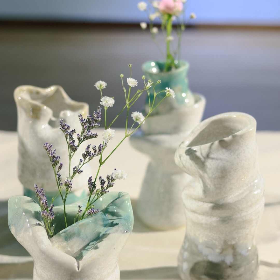 Ceramic vases with organic shapes in white, light blue and green glazes